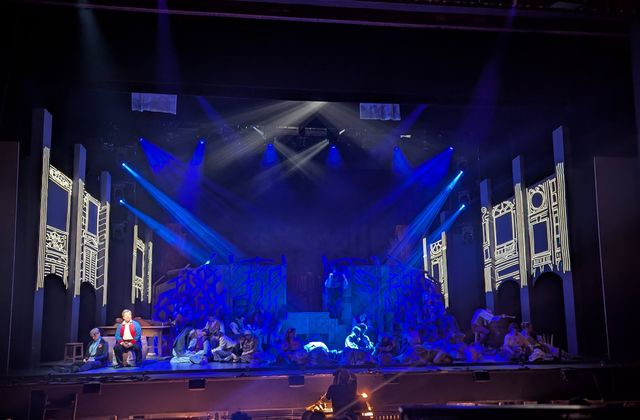 Architectural projection across the scenic walls