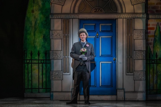 My Fair Lady — performer with flowers outside 27A